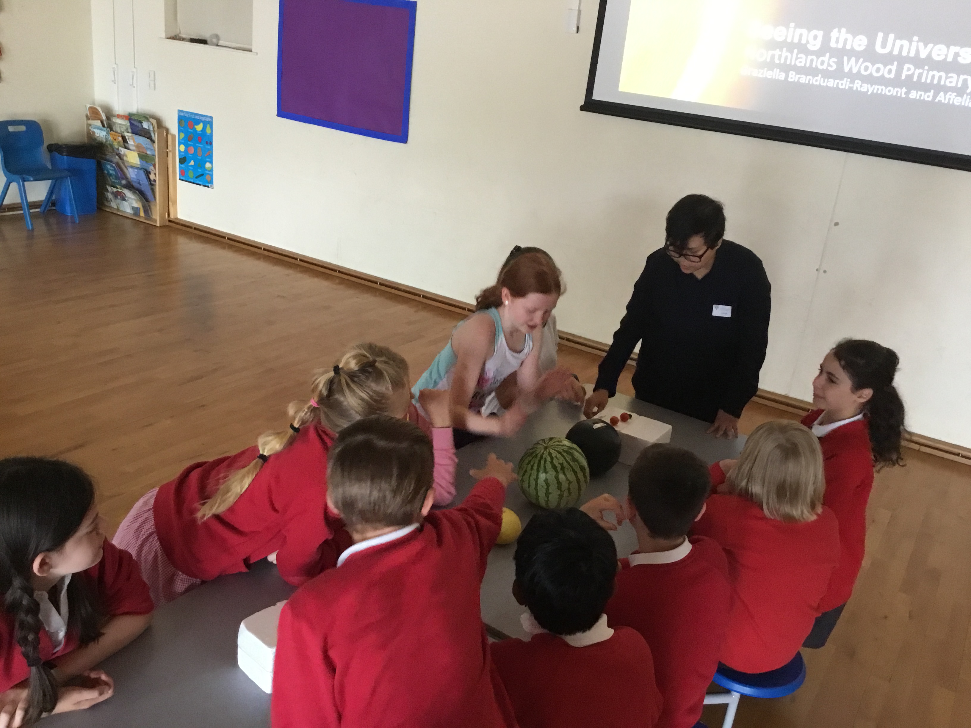 A photo of Affelia talking to primary school pupils.